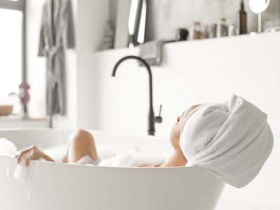 Young attractive woman relaxing in bathtub Young attractive woman relaxing in bathtub