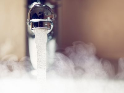 water tap with hot water steam water tap with hot water steam, closeup view