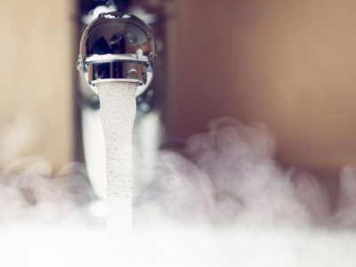 water tap with hot water steam, closeup view